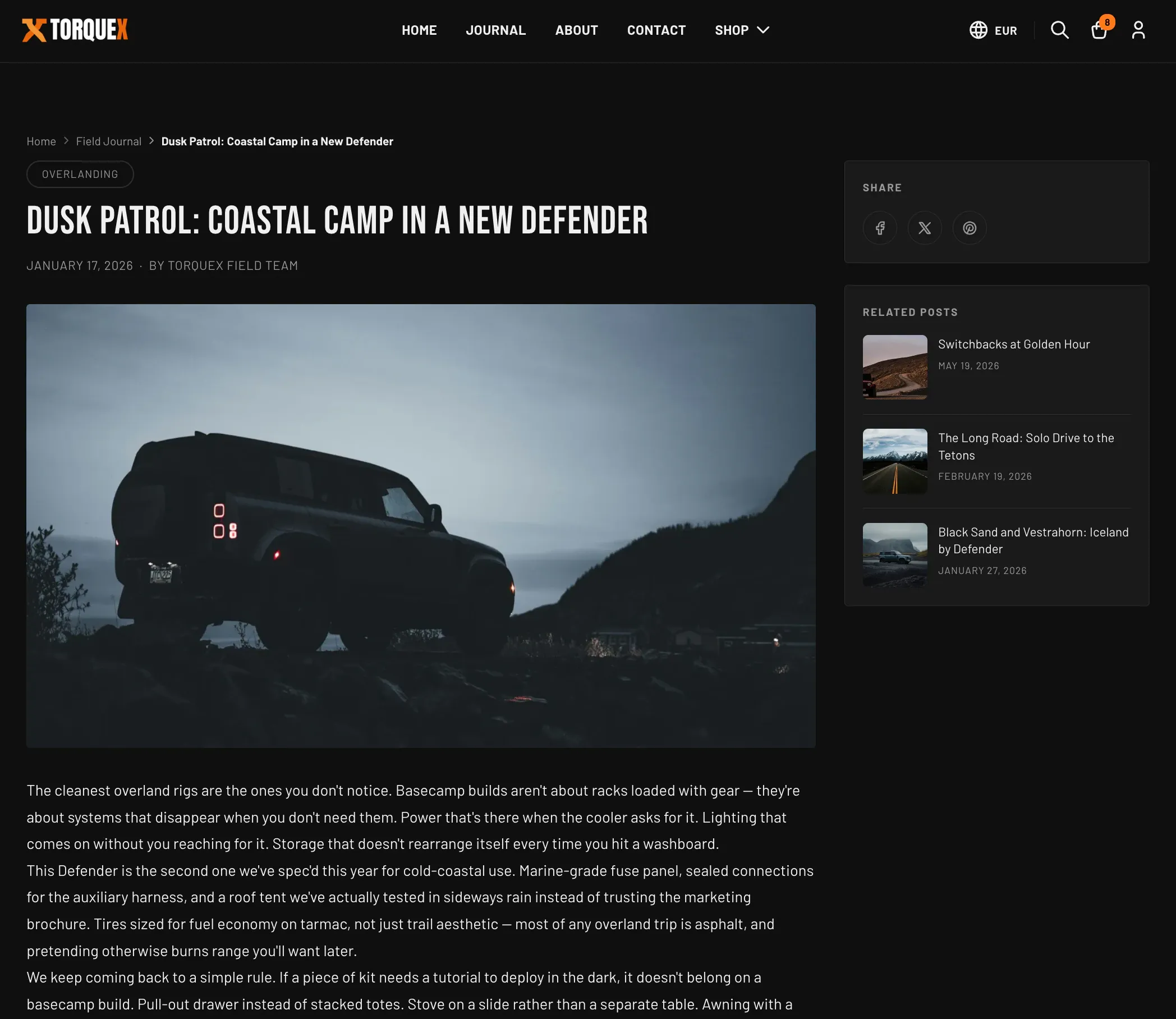 The Torquex article page — breadcrumbs and an "Overlanding" tag above the title "Dusk Patrol: Coastal Camp in a New Defender", a wide hero photo, the article body, and a sidebar with Share buttons and a "Related posts" list of thumbnailed links
