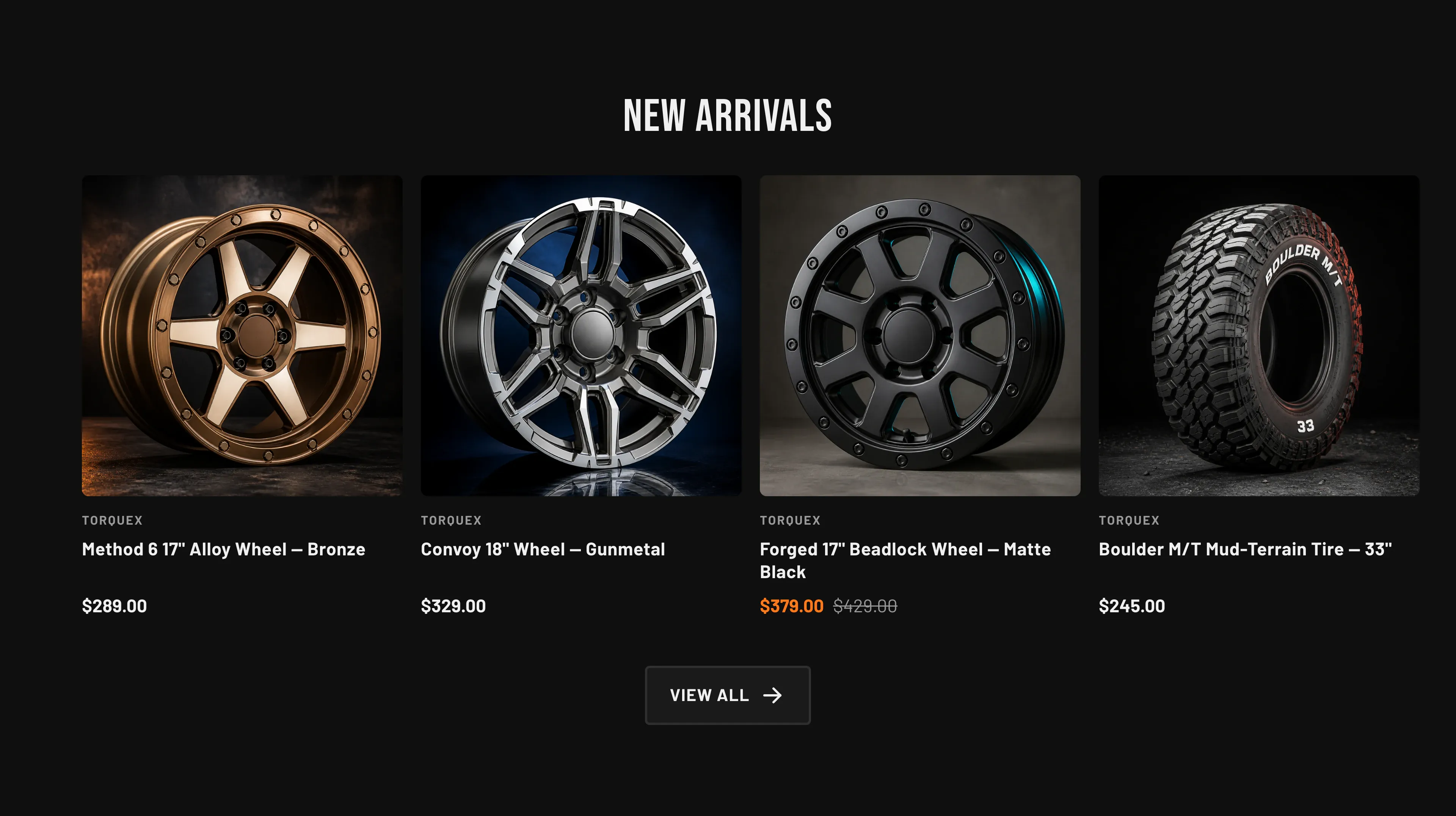 Torquex Featured products section on a near-black background: a centered "New arrivals" heading above a four-up row of square product cards — a bronze alloy wheel, a gunmetal wheel, a matte-black beadlock wheel (on sale, with an orange price), and a mud-terrain tire — each with a vendor line, title and price, and a "View all" button below.