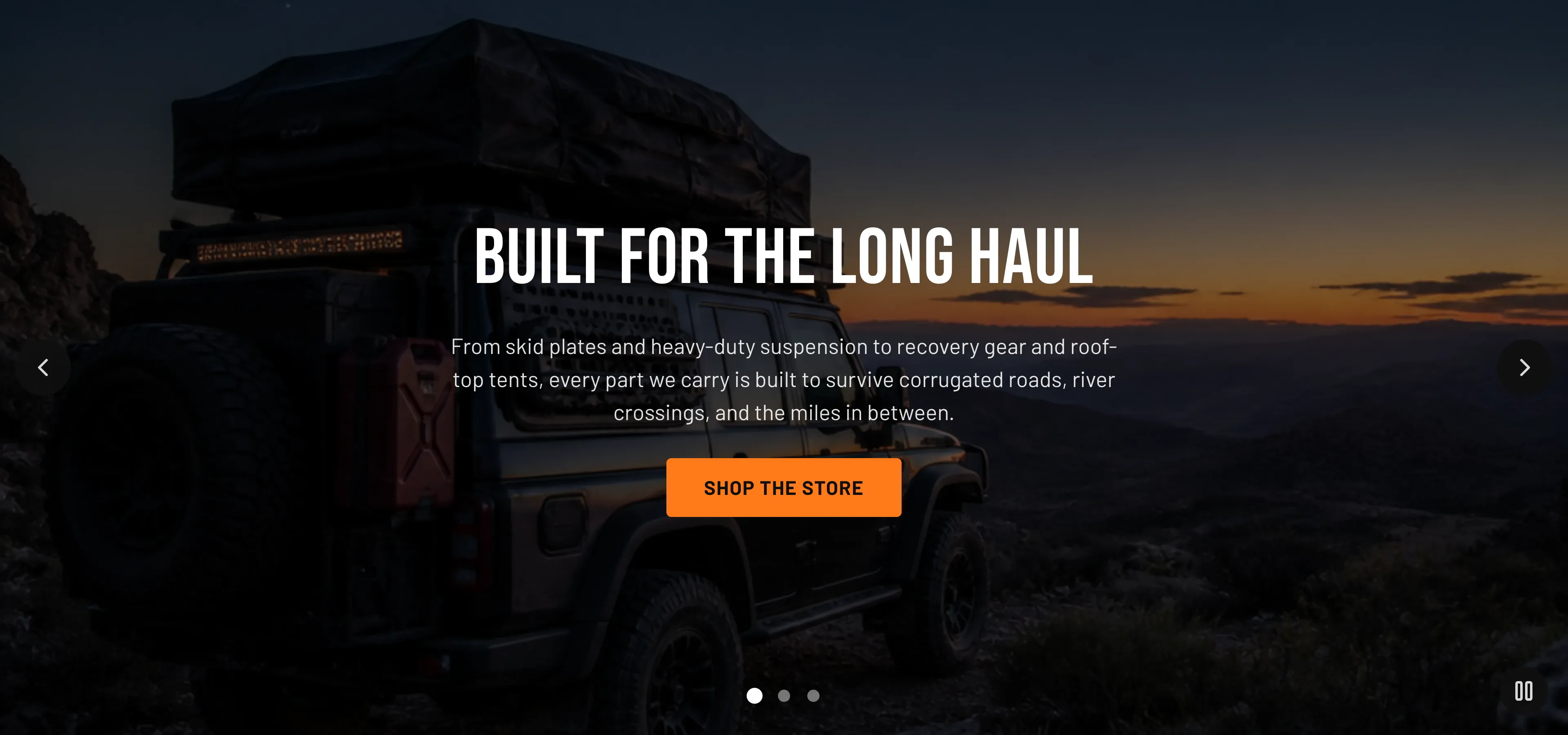 The Torquex hero slideshow showing one active slide — a dusk overlanding photo of a rooftop-tent rig on a ridge, darkened by an overlay, with the centered uppercase heading "Built for the long haul", supporting copy, and an orange "Shop the store" button, framed by prev/next arrows, a row of three navigation dots, and a play/pause control